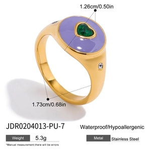 Detail of 18K gold stainless steel ring with purple enamel and green heart zircon