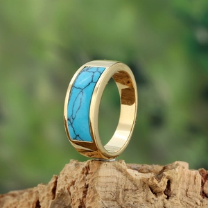 Minimalist gold stainless steel ring featuring a rectangular turquoise gemstone inlay