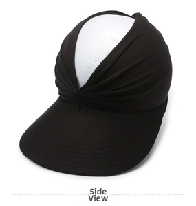Detail view of black sun visor featuring pleated band design and wide stitched brim