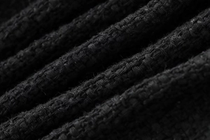 Detailed macro view of high-quality black tweed woven fabric texture with belt material