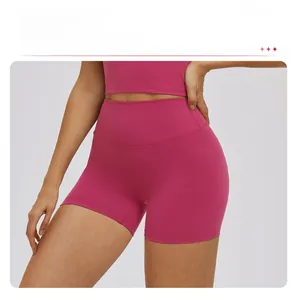 Detailed close-up of high-waist yoga shorts with tummy control and anti-rolling hem