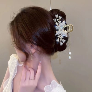 Elegant gold metal butterfly and lily of the valley hair claw clip with pearl tassels