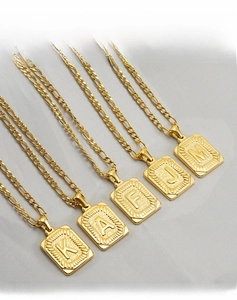 Set of five 18K gold plated stainless steel Figaro chains with hollow letter pendants