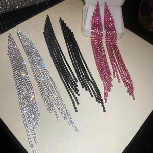 Detail of silver, black and magenta long fringe tassel earrings with sparkling rhinestones