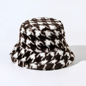Macro shot of houndspurck pattern on black and white thick plush winter bucket hat