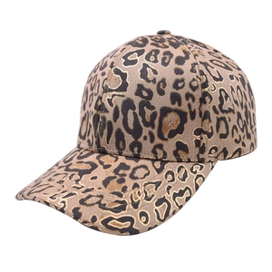 Detailed view of leopard print baseball cap with metallic gold accents and suede texture
