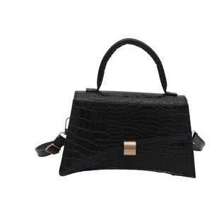 Minimalist black crocodile pattern underarm bag with curved base and adjustable strap