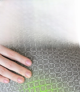 Detail of non-slip silicone backing on breathable linen rug for living room