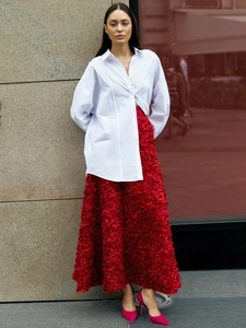 White oversize shirt with red high-waist long skirt featuring 3D petal textures
