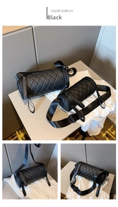 Detailansicht der gesteppten schwarzen Zylindertasche mit Nylongurt und Reißverschluss