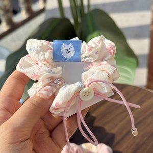Floral scrunchie with blue dog label and button detail for women hair styling