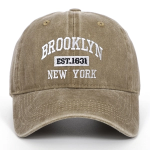Detailed white Brooklyn embroidery on khaki washed cotton baseball cap front view