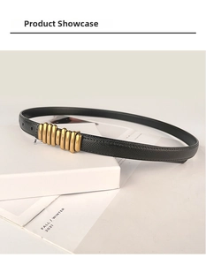 Detailed macro of vintage black leather belt with a ridged gold buckle design