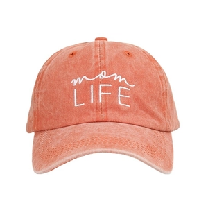 Washed coral cotton baseball cap featuring mom LIFE embroidery on a white background