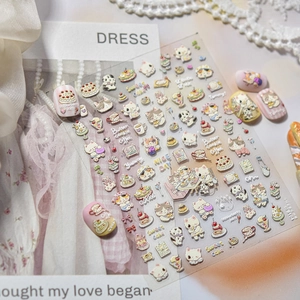 Detailed 3D embossed nail stickers featuring dessert and cat patterns in soft colors