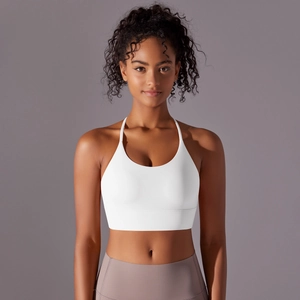 Close-up of white sports bra with narrow halter straps and elastic wide underband