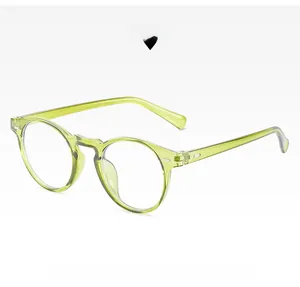 Detail of round green anti-blue light glasses with silver rivets and transparent frame
