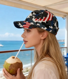 Side view of camouflage baseball cap with US flag design worn during outdoor activities