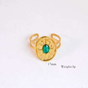 Detail of 14k gold plated ring with green oval gemstone and 17mm size specifications