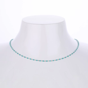 Close-up of S925 silver necklace with turquoise beads on a white neck bust display