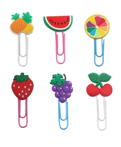 Detailed view of colorful fruit-themed paper clips including pineapple and strawberry shapes
