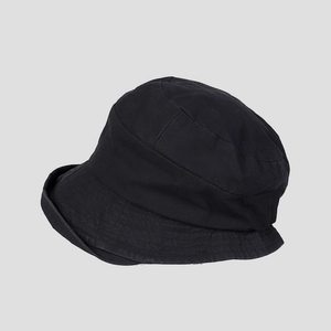Detailed view of black cotton bucket hat with reinforced brim stitching and minimalist design