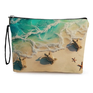 Canvas sea turtle makeup bag with beach ocean print, zipper closure and wristlet strap