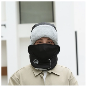 Detail of winter trapper hat with windproof fabric, faux fur lining and face mask