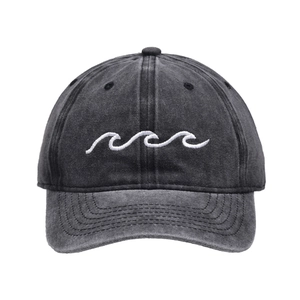 Close-up of wave embroidery on washed black cotton denim baseball cap with curved brim