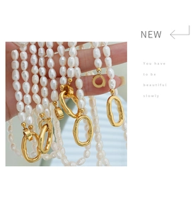 Close-up of Baroque freshwater pearl necklaces with irregular golden metal clasps