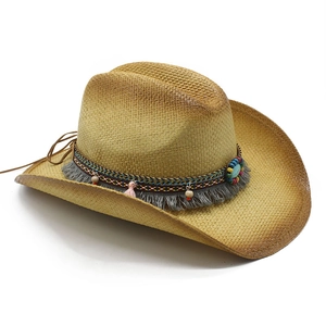 Ethnic western cowboy straw hat with turquoise beads and tassel trim on white background