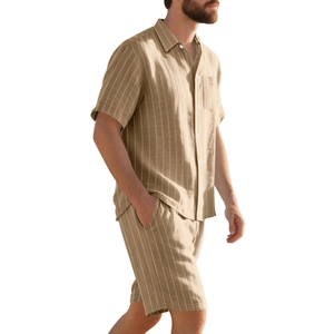 Detail of men's beige linen set with vertical white stripes and button-down shirt texture