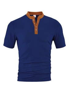Detailed view of dark blue textured fabric and contrast tan placket on men's shirt