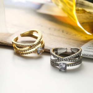 Minimalist gold and silver adjustable cross rings with sparkling cubic zirconia accents