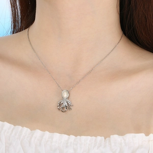 Silver stainless steel octopus necklace with white cat's eye stone and sparkling crystals