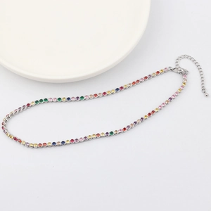Macro shot of silver rainbow choker necklace with colorful stones and adjustable chain