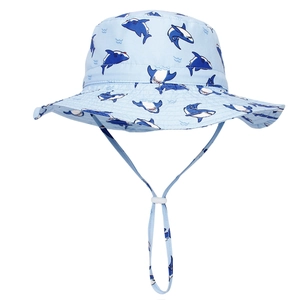 Detail of baby sun hat with shark print, breathable fabric and adjustable chin strap