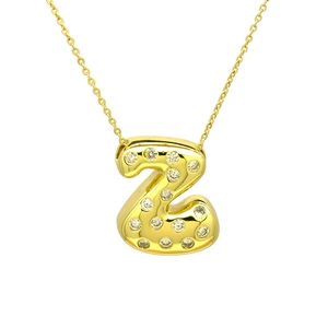 Close-up of golden balloon letter Z pendant necklace with sparkling cubic zirconia