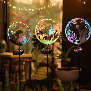 Solar garden silhouette lights featuring dog cat and gnome designs with colorful LED glow