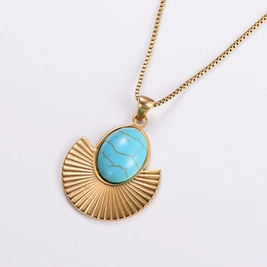 Vintage gold necklace featuring a turquoise pendant with a bohemian radial fan design