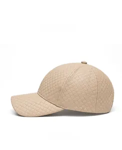 Side view of beige quilted PU leather baseball cap showing texture and stitching