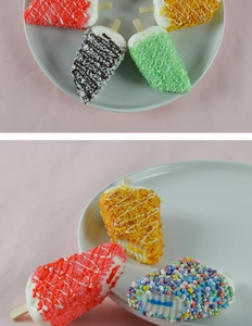 Macro shot of assorted colorful artificial popsicles with various textures and wooden sticks