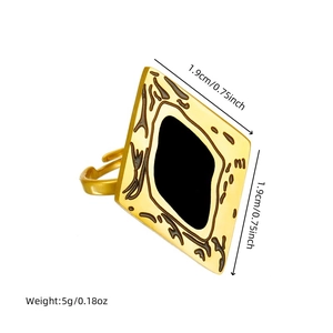 Detail view of gold rhombus ring with black textured inlay and size specifications