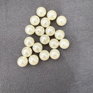 Detailed view of white ABS wrinkled faux pearl beads with pre-drilled holes for DIY jewelry