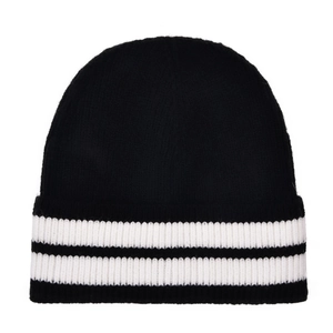 Detail view of the thick knit texture and black-white stripe pattern on the beanie