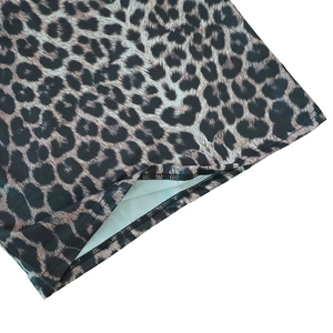 Detail of double-stitch hem and fabric texture on a stylish leopard print maxi dress