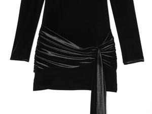 Close-up of velvet dress featuring a pleated satin waistband and elegant draping ties