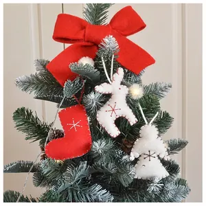 Detailed view of handmade felt Christmas tree ornaments with embroidery and stitching