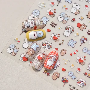Detail of embossed cartoon bear nail art stickers with heart and plaid patterns