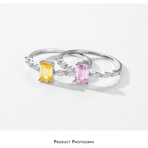 Detail of S925 sterling silver rings with yellow and pink emerald-cut stones